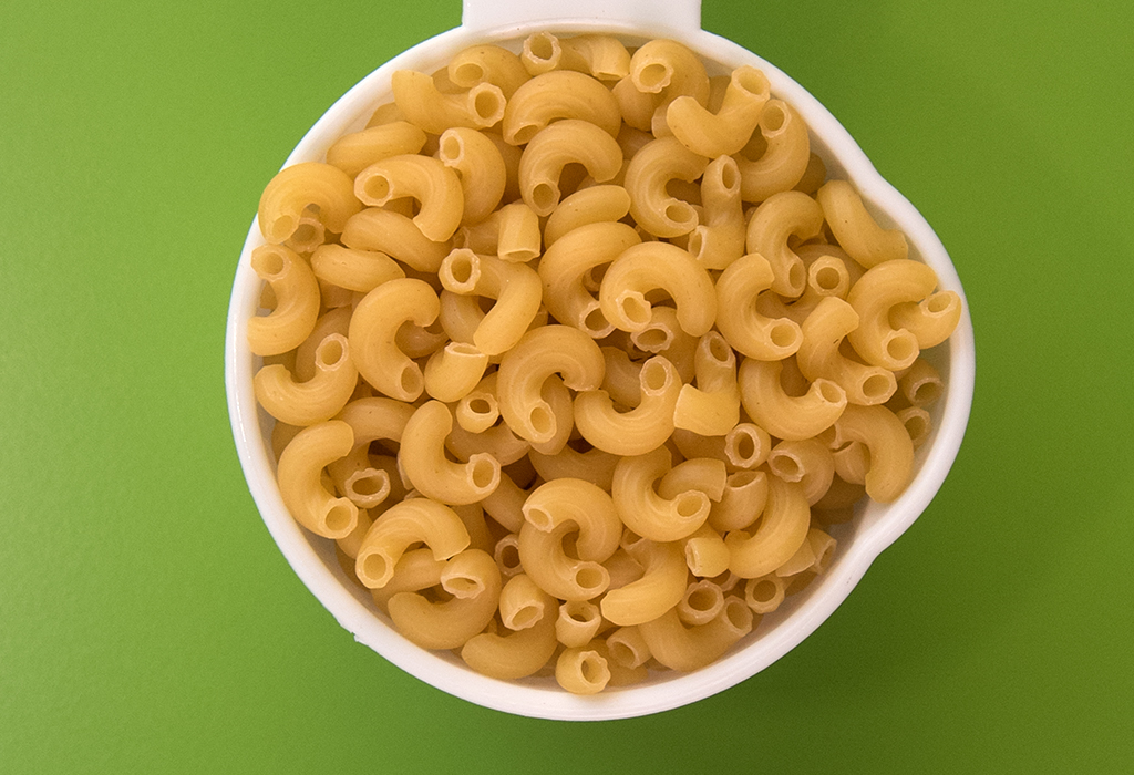A bowl of cooked macaroni noodles.