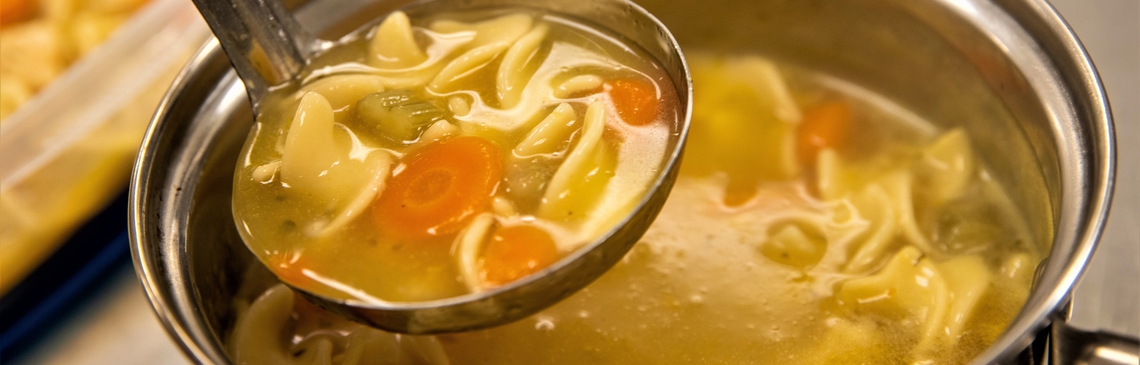 A ladle full of soup.