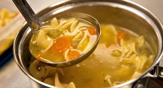 A ladle full of soup.