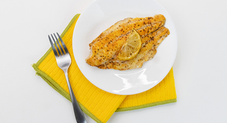 1 lemon fish filet on a white plate
