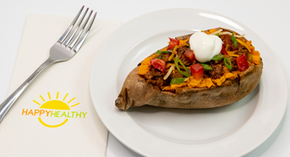 A plate with a taco stuffed sweet potato