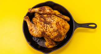 A whole chicken in a skillet