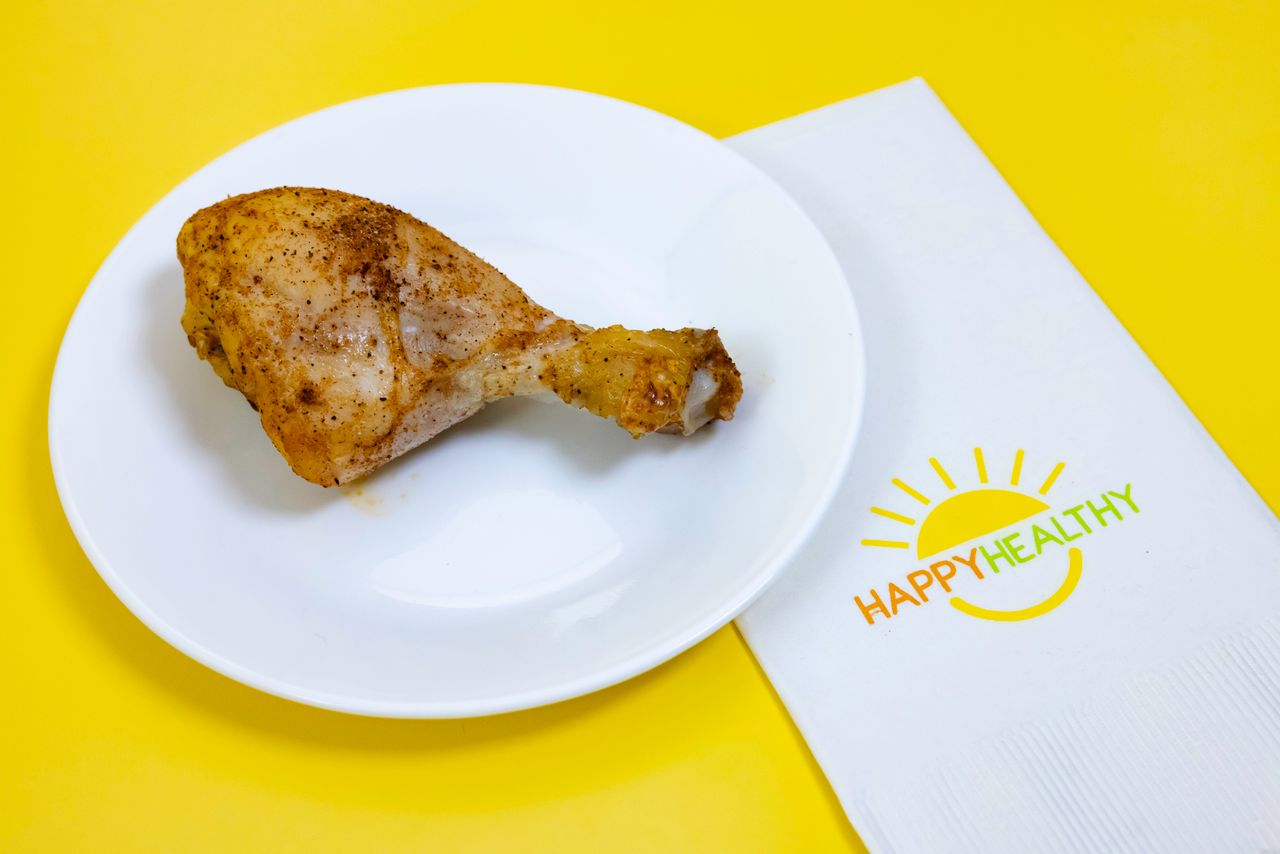A white plate with a Buttermilk Baked Drumstick