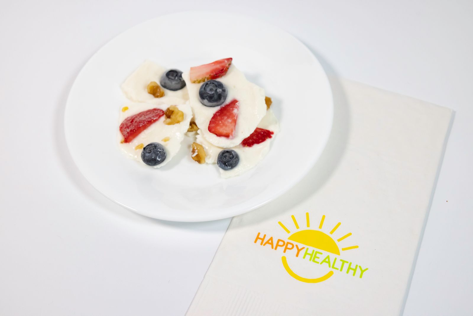 A white plate with Frozen Yogurt Bark