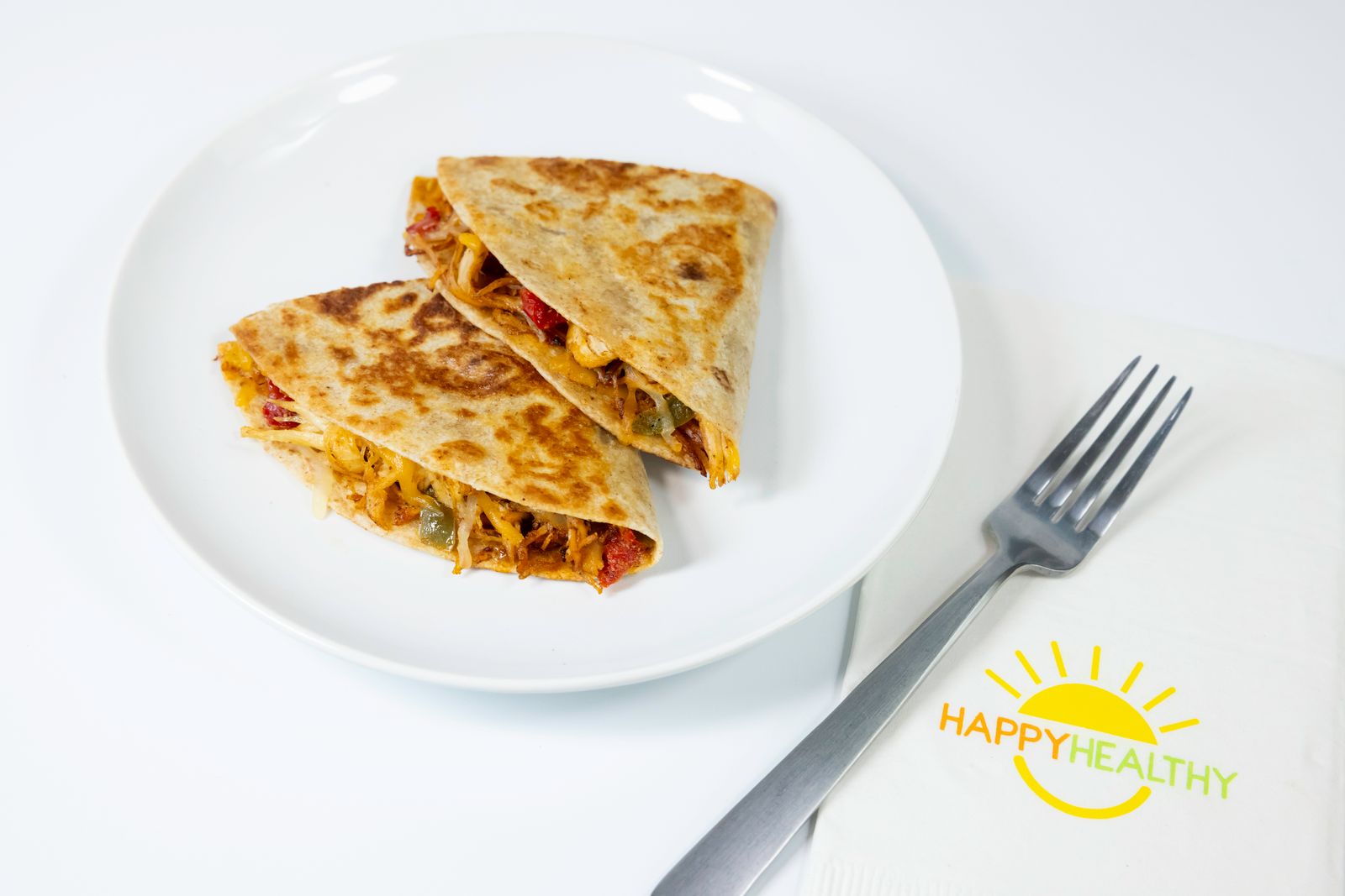 A white plate with Chicken Quesadillas