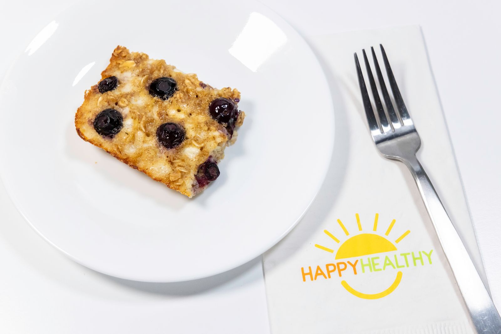 A plate of Blueberry Breakfast Bake on a white background