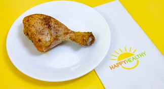 A white plate with a Buttermilk Baked Drumstick