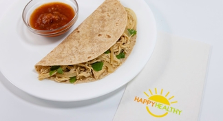 A plate of with a Salsa Verde Chicken quesadilla and salsa