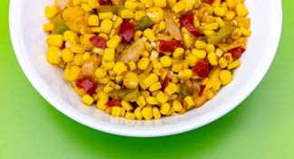 A white bowl of Fiesta Hominy And Corn