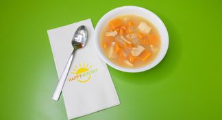 A bowl of chicken and sweet potato soup