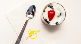 A container of the berry blast off recipe and a spoon and napkin beside.