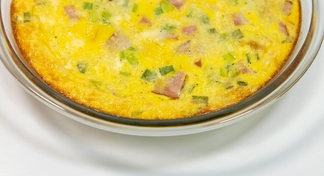 A pan of Crustless Ham and Cheese Quiche