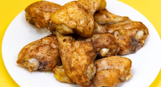 A white plate with Buttermilk Baked Drumsticks