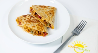 A white plate with Chicken Quesadillas