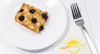 A plate of Blueberry Breakfast Bake on a white background