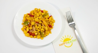 A white plate of Fiesta Hominy And Corn