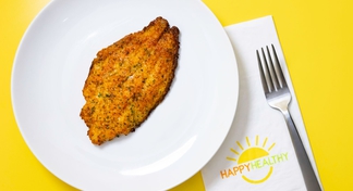 A white plate with Parmesan Crusted Catfish